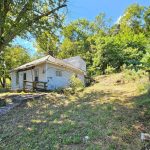 original house on hillside property before demolition while moving to Glouster Ohio