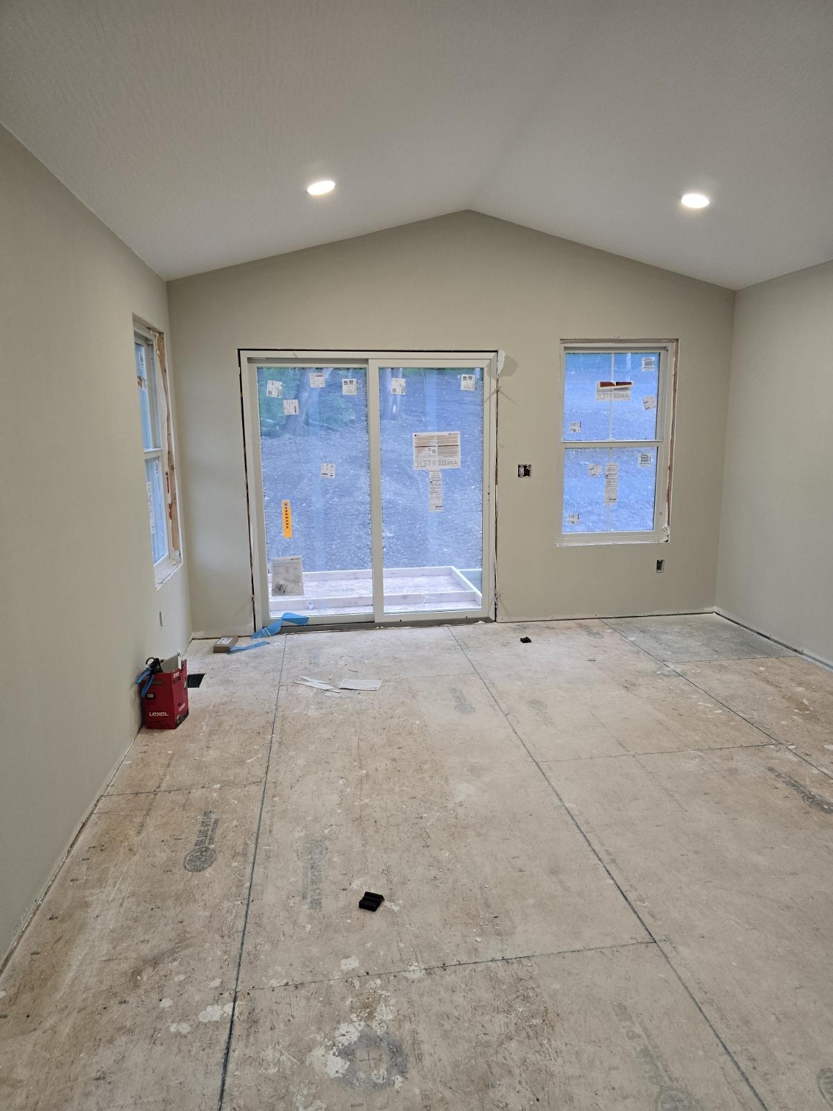 Interior room with sliding glass doors and windows in Glouster Ohio home under construction