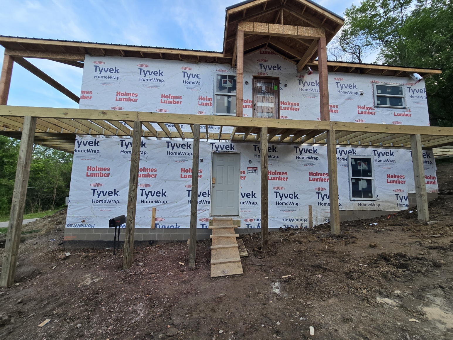 Hillside home construction in Glouster Ohio showing elevated deck and structure